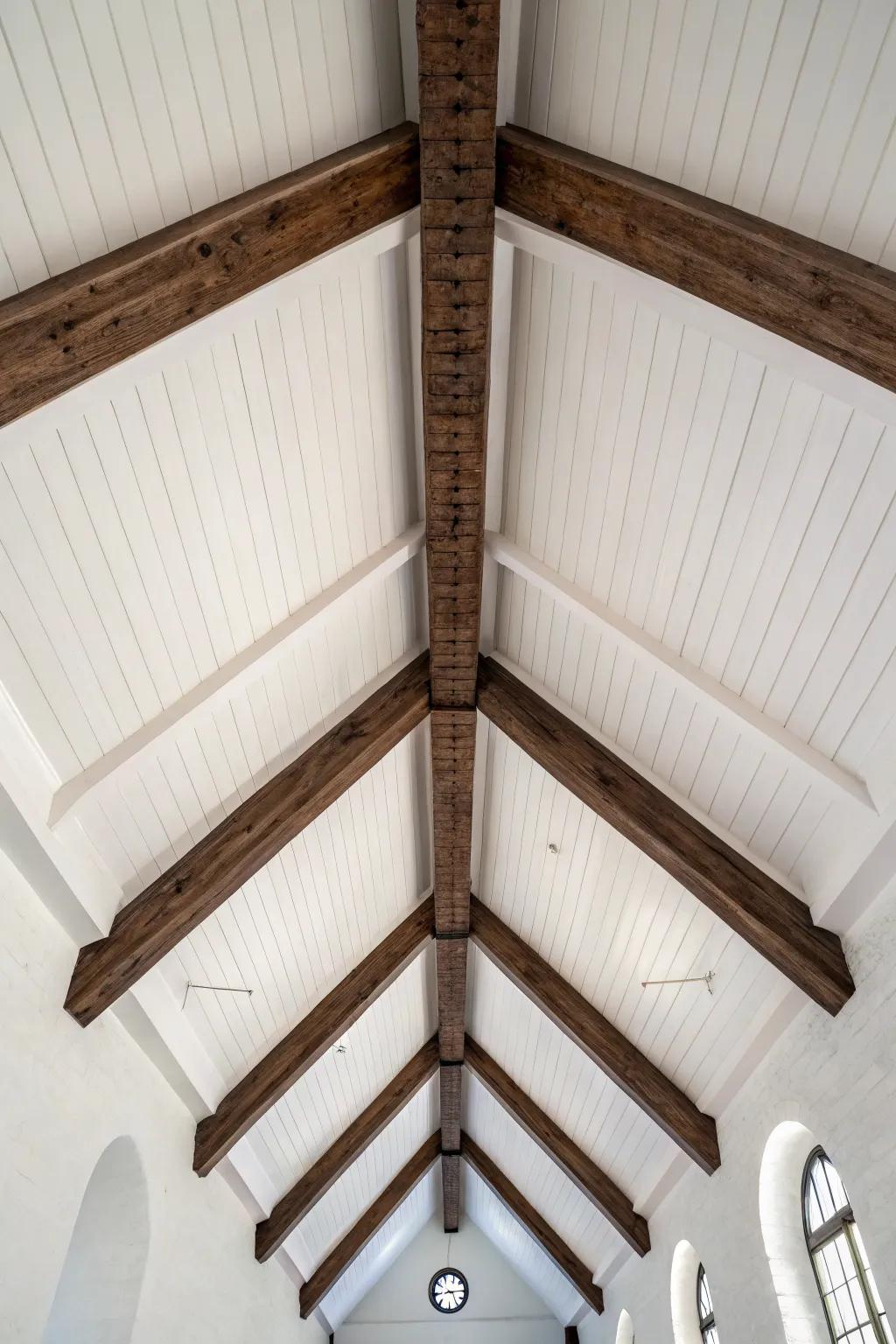 Crisp white vault + rich dark timber beams—timeless contrast that makes ceilings feel designed.