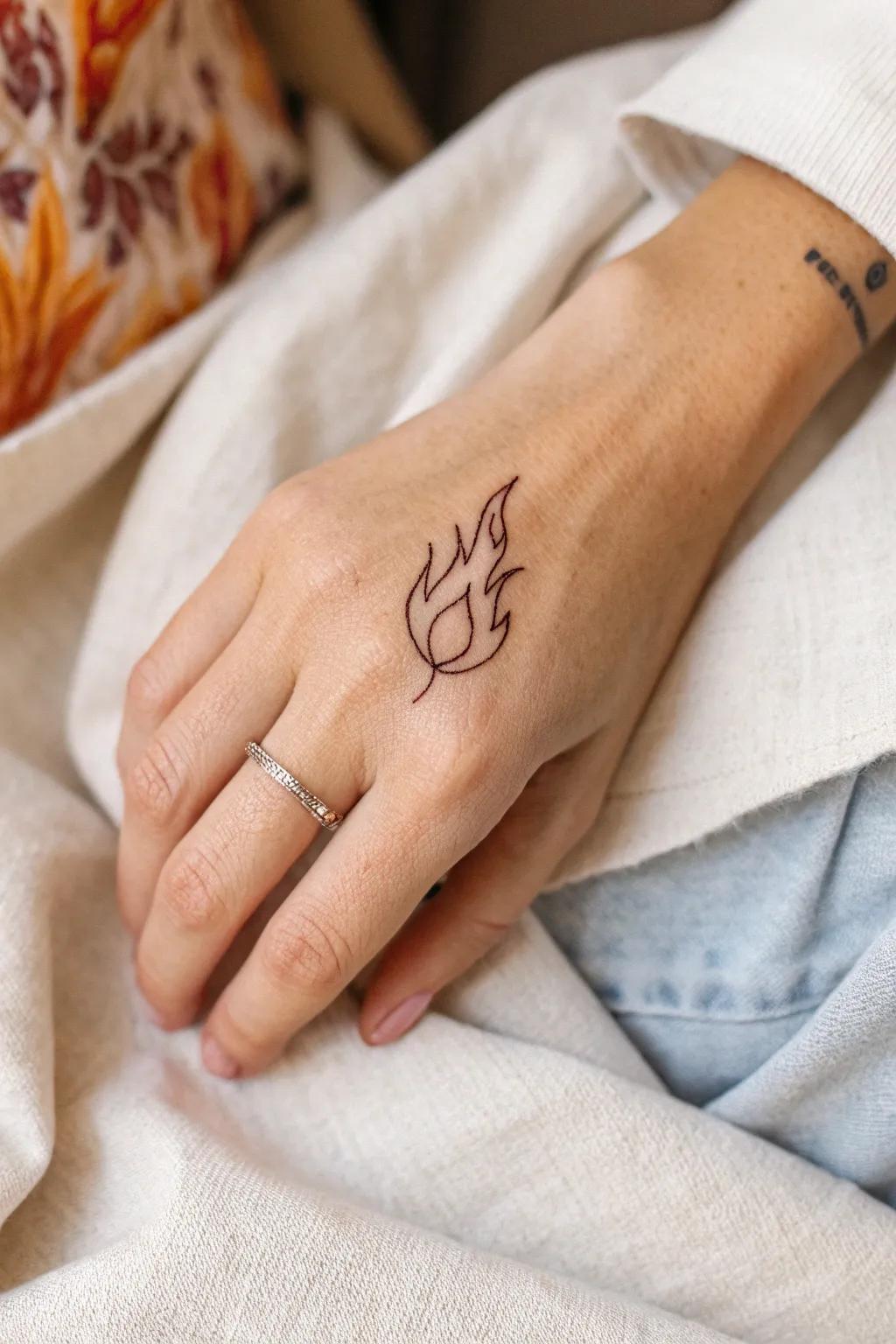 Ignite your creativity with a simple yet elegant flame tattoo.