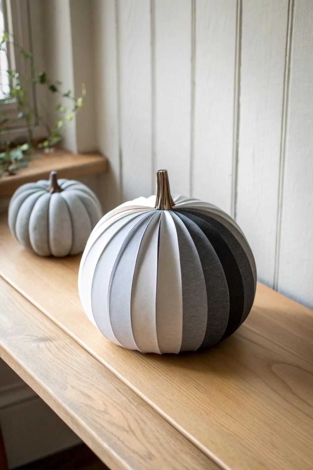 Elevate your decor with a minimalist monochrome paper pumpkin—simplicity meets sophistication.