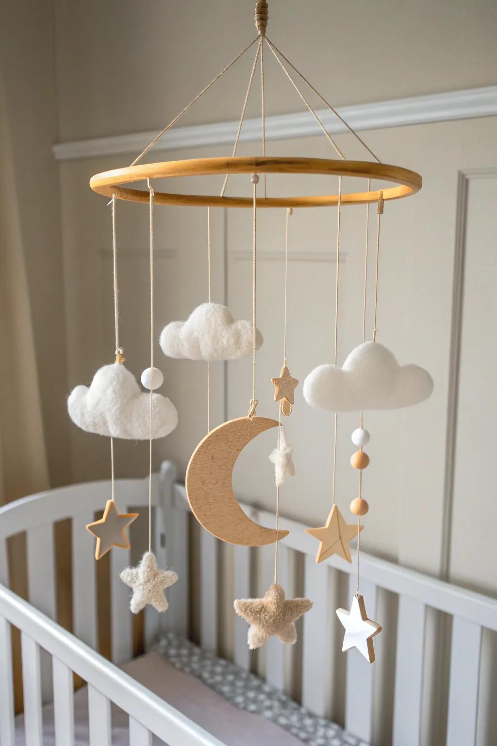 Simple wood-and-felt mobile: airy movement, soft neutrals, and handcrafted calm above the crib.