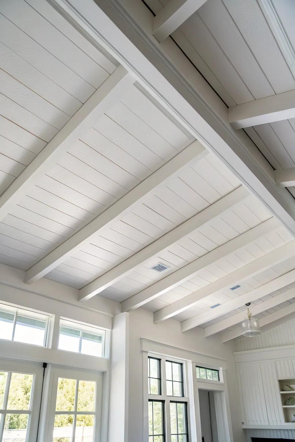 Crisp white-on-white box beams create airy depth—soft shadow lines make ceilings feel taller.
