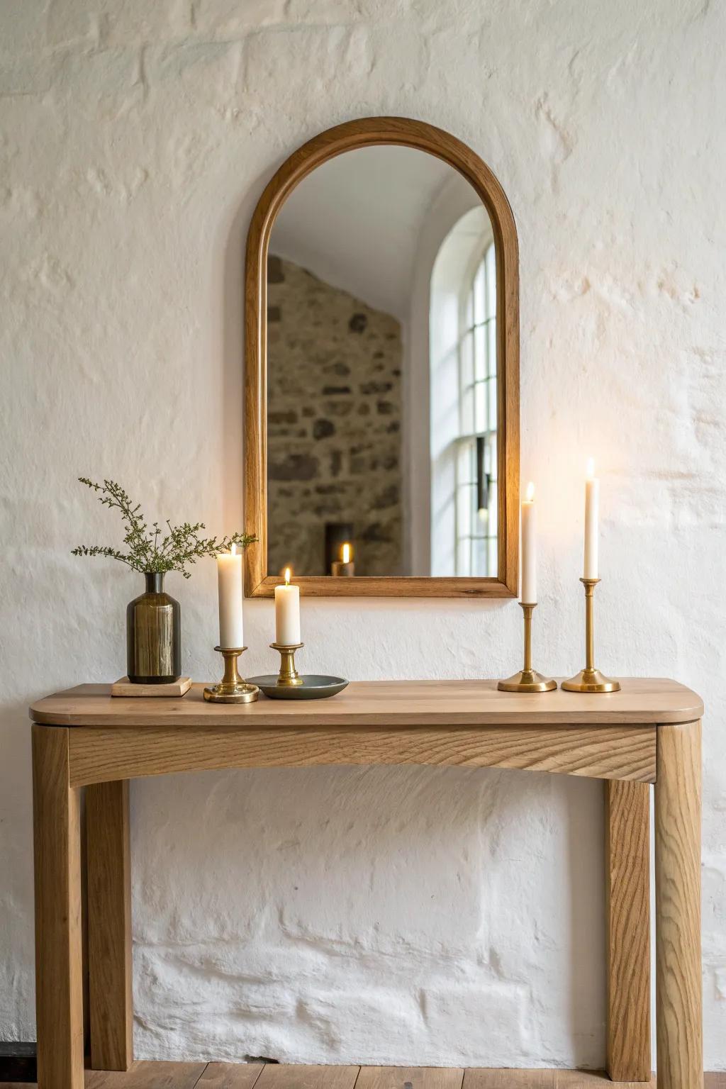 Warm candlelight dancing in an arched mirror above a handmade oak console—cozy, simple, serene.
