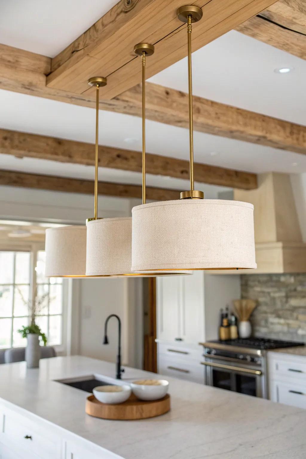 Two or three pendants over a kitchen island—balanced spacing that feels natural on wood beams.