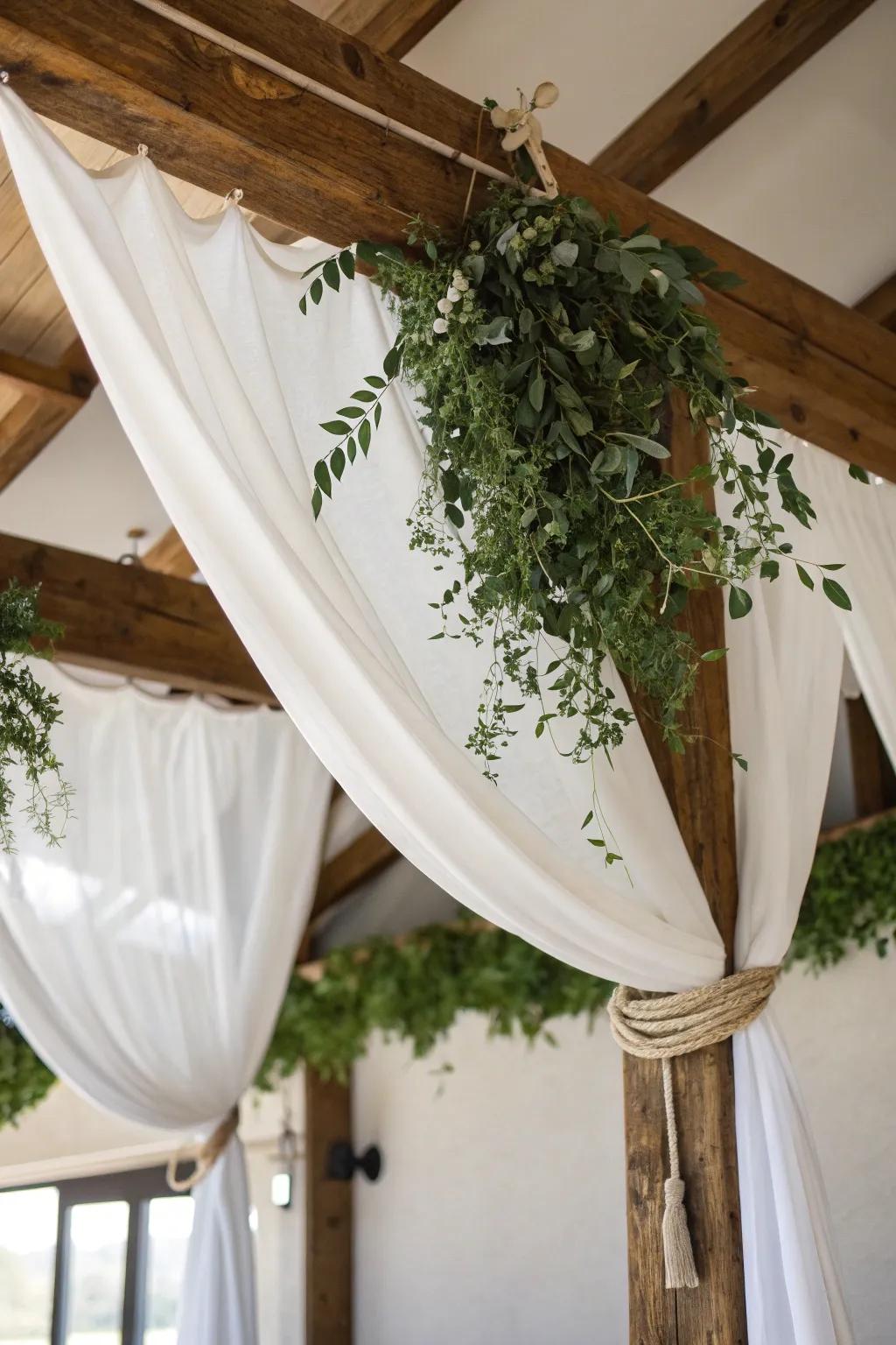 White linen ceiling drapes with deep green swags—an indoor forest feel with rustic elegance.