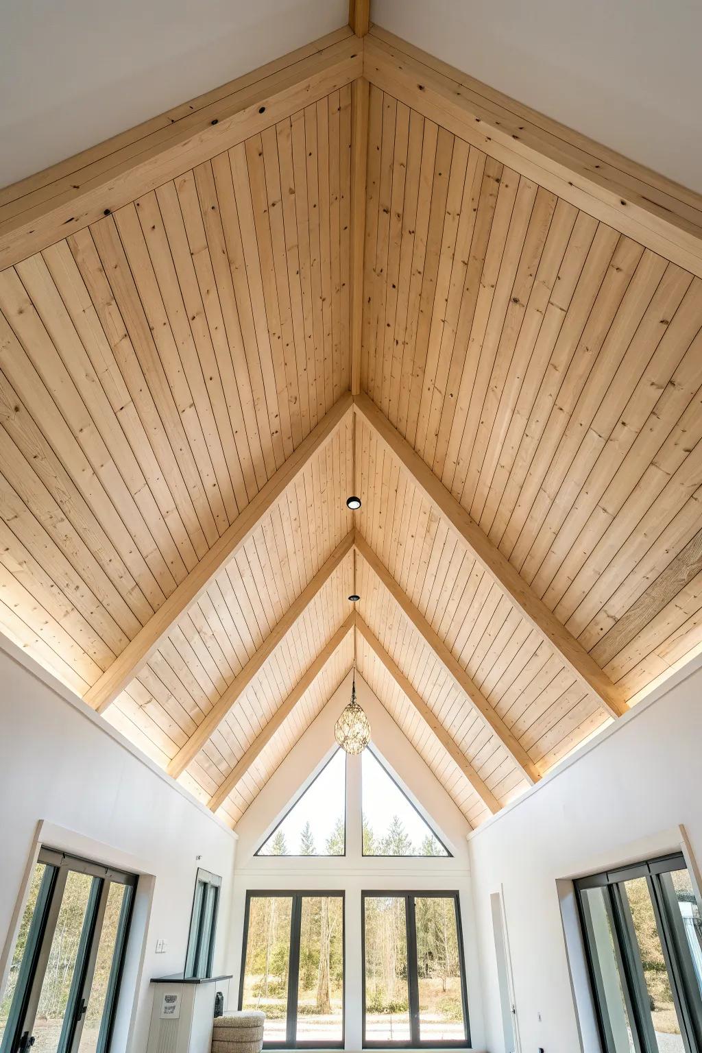 Light-stained planks keep a vaulted ceiling bright and airy while the wood grain still shines.