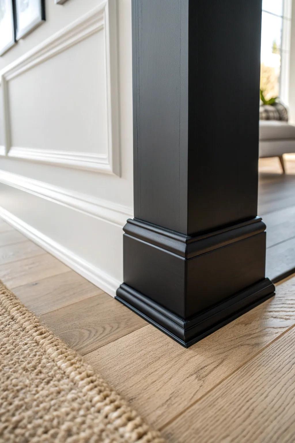 Black baseboards create a crisp modern frame against light walls and natural wood floors.