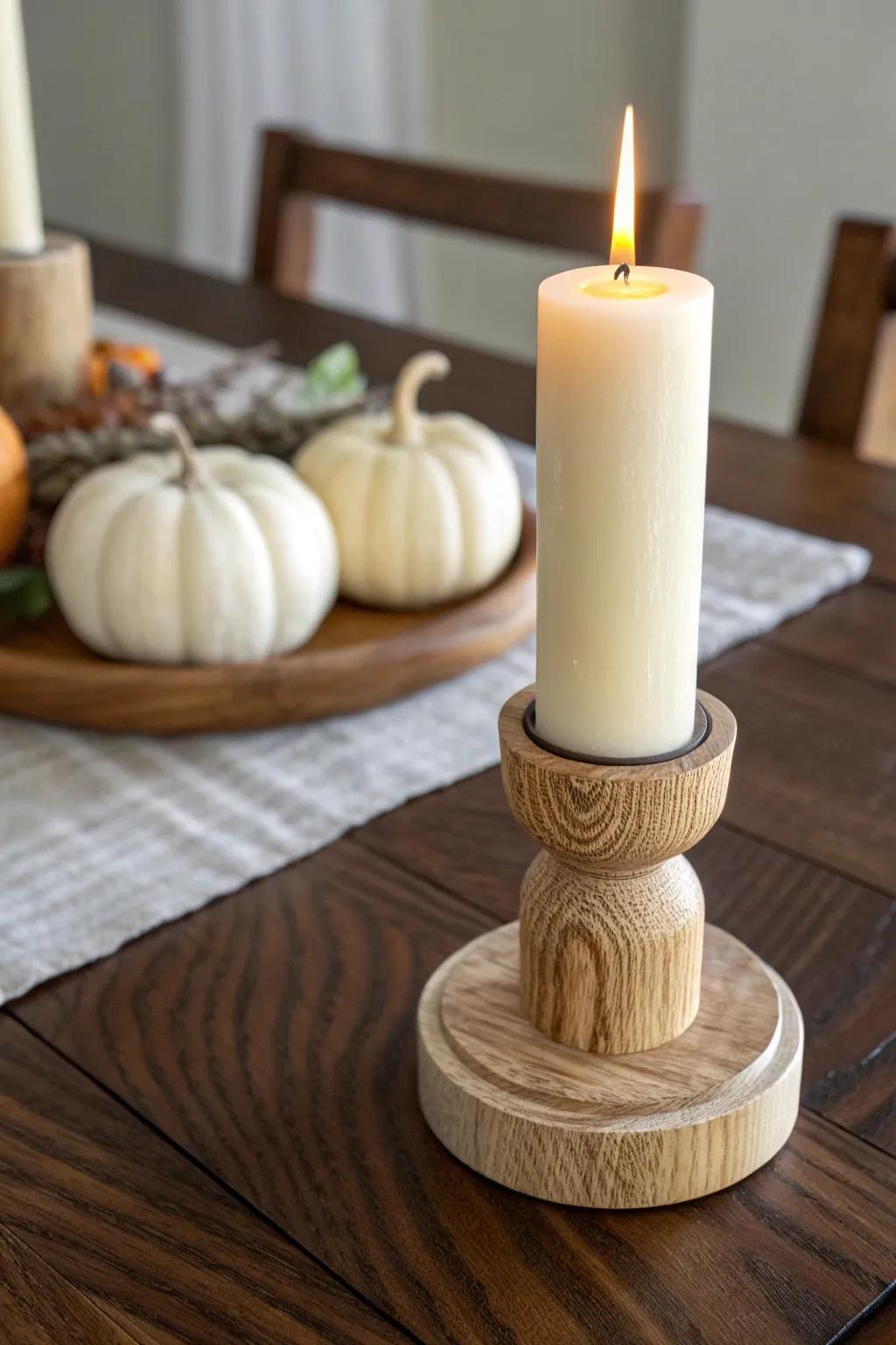 Hand-turned wood candlestick + a soft taper glow—simple height that warms any fall table.