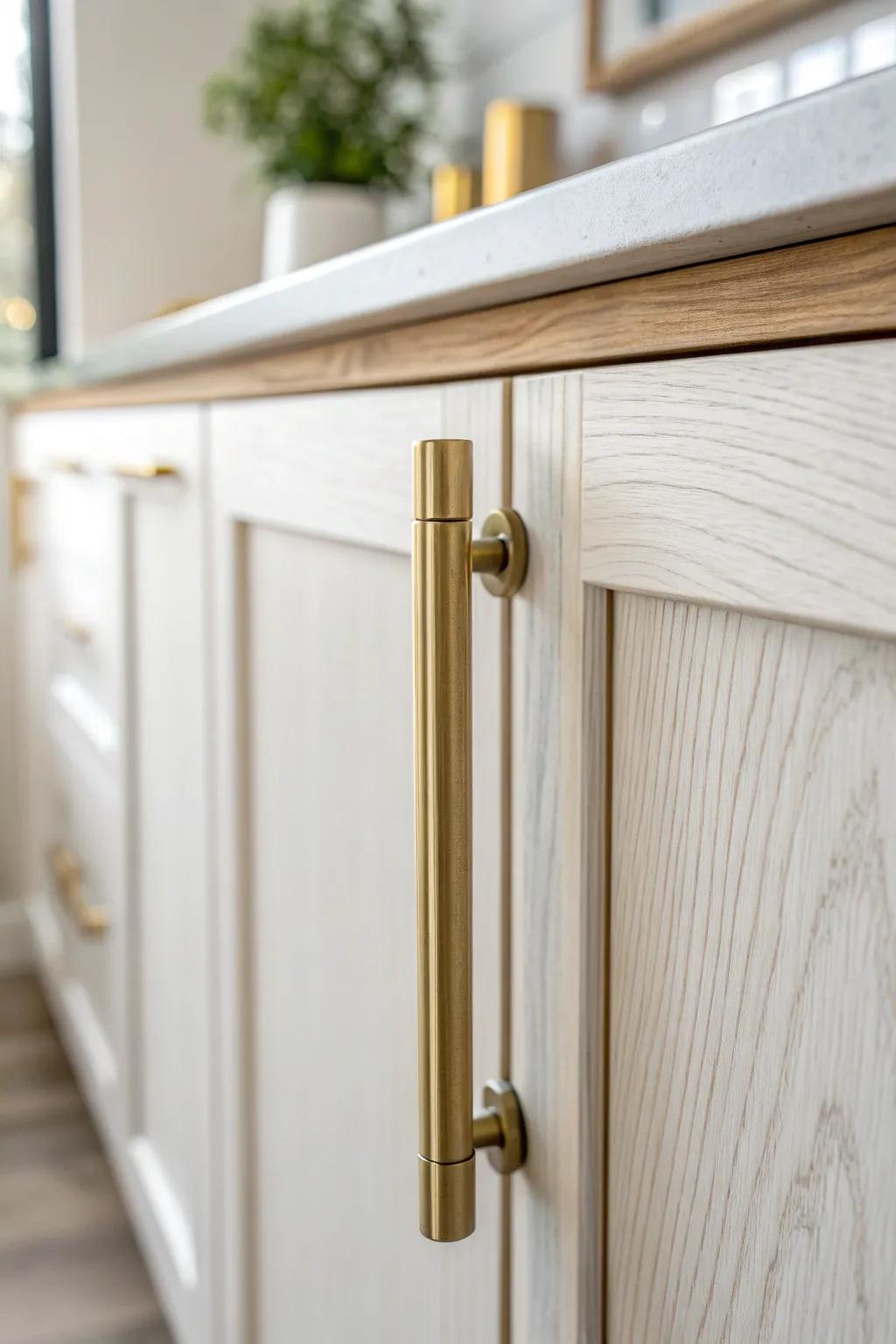 Swap to brushed brass pulls for a relaxed, collected warm-white kitchen look with subtle glow.