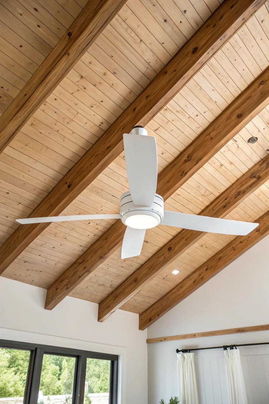 A long-downrod fan light that suits vaulted wood ceilings—airy, warm, and beautifully minimal.