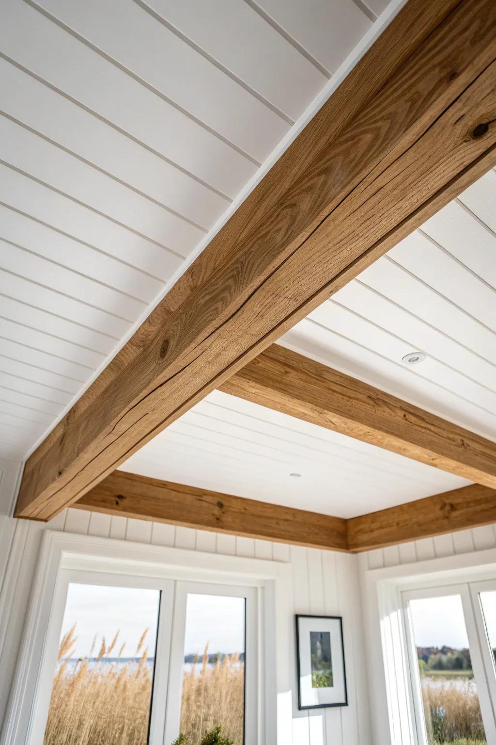 Warm oak beam wrap trim band adds farmhouse structure—lightweight look, big ceiling impact.