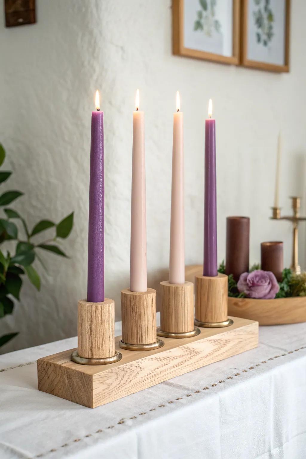 Four matching satin-finished wood holders let violet and rose Advent candles shine in calm simplicity.
