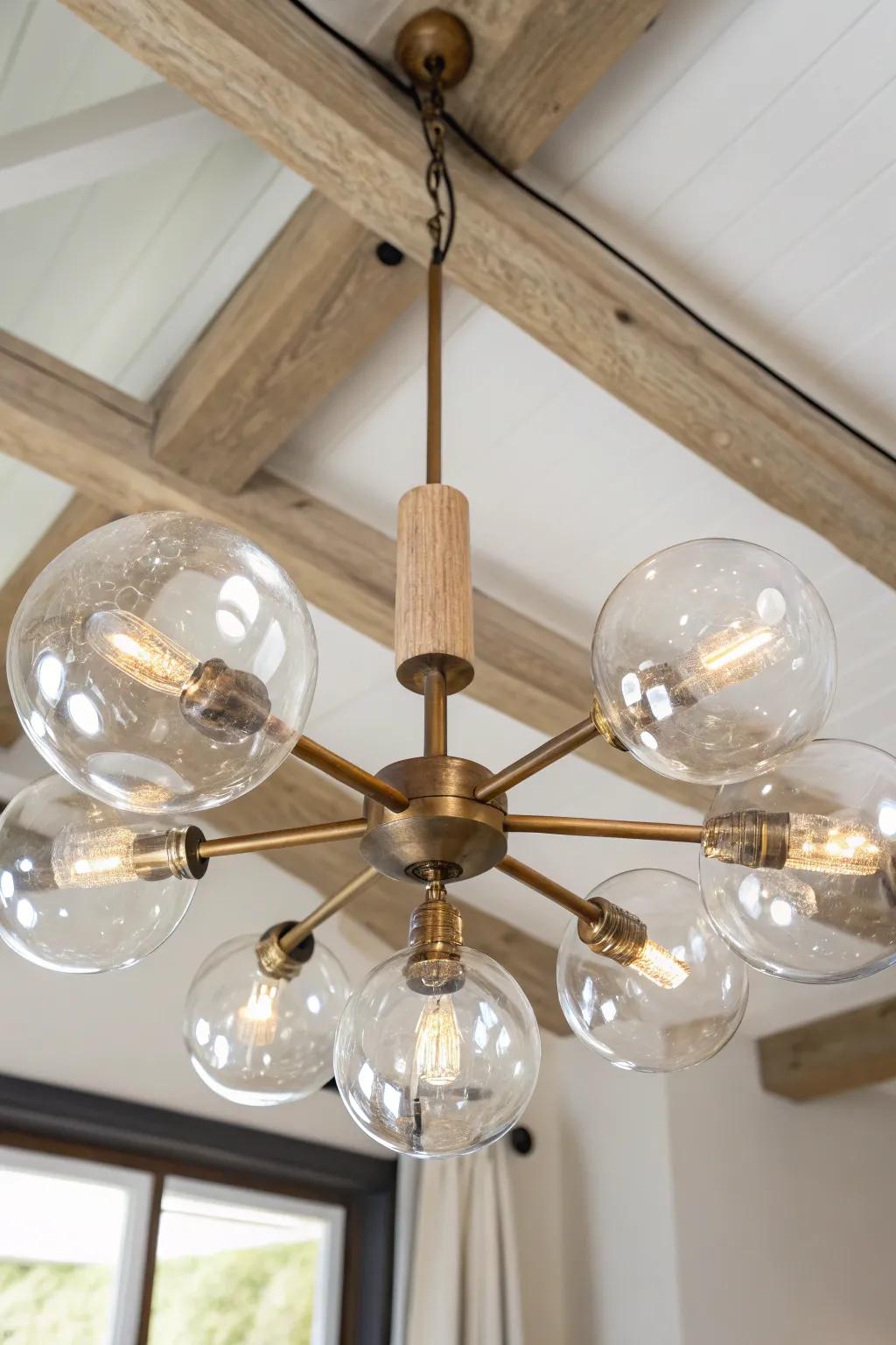 Clear glass globe chandelier that brightens a cozy cottage—warm glow, airy, handcrafted charm.