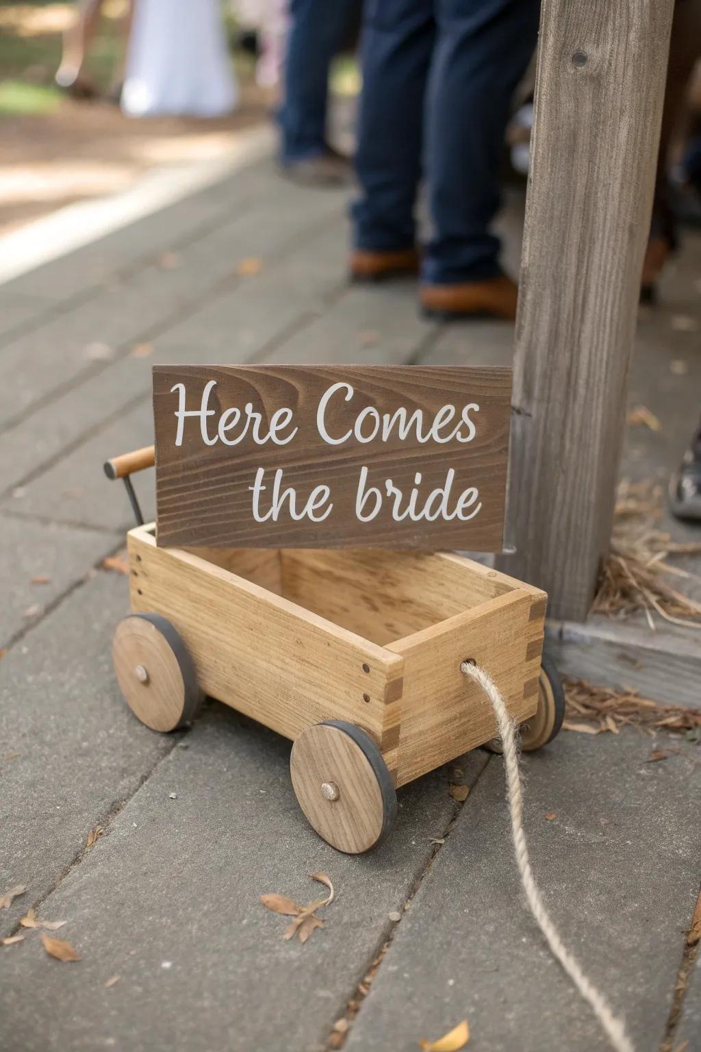 Hand-lettered “Here Comes the Bride” sign board tied with twine—simple, sweet, and timeless.