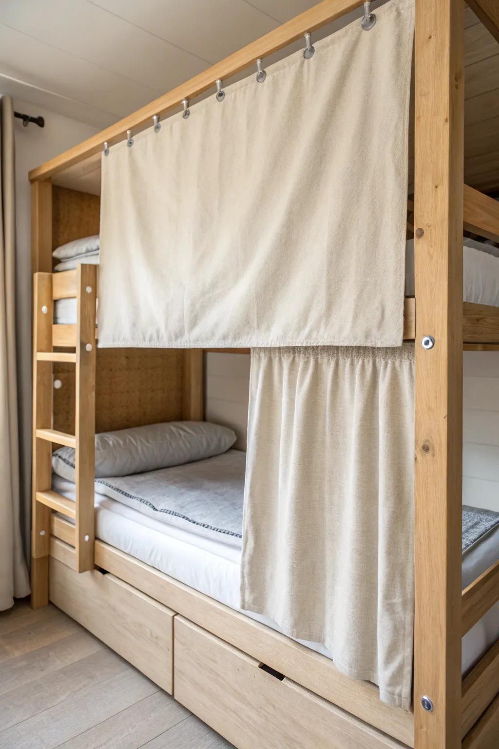 Roll-up linen shade on a birch bunk: simple, cozy privacy that disappears in a pull.