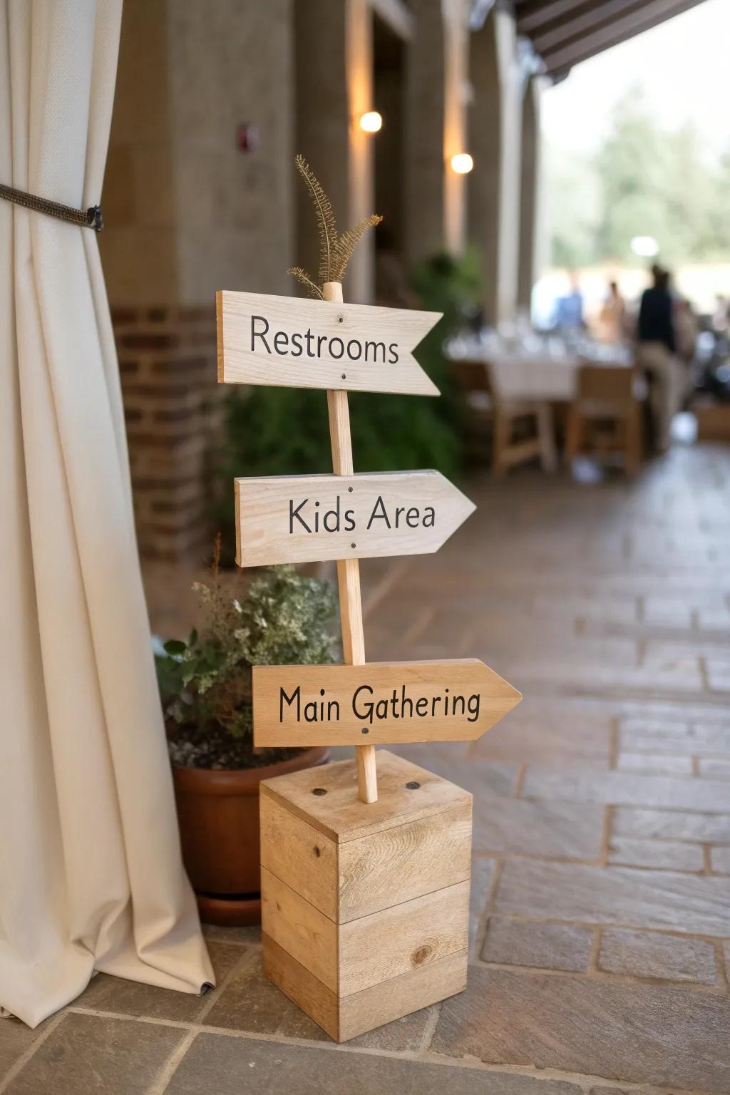 Handmade mini signposts guide guests—restrooms, kids, gathering—simple, warm, welcoming.