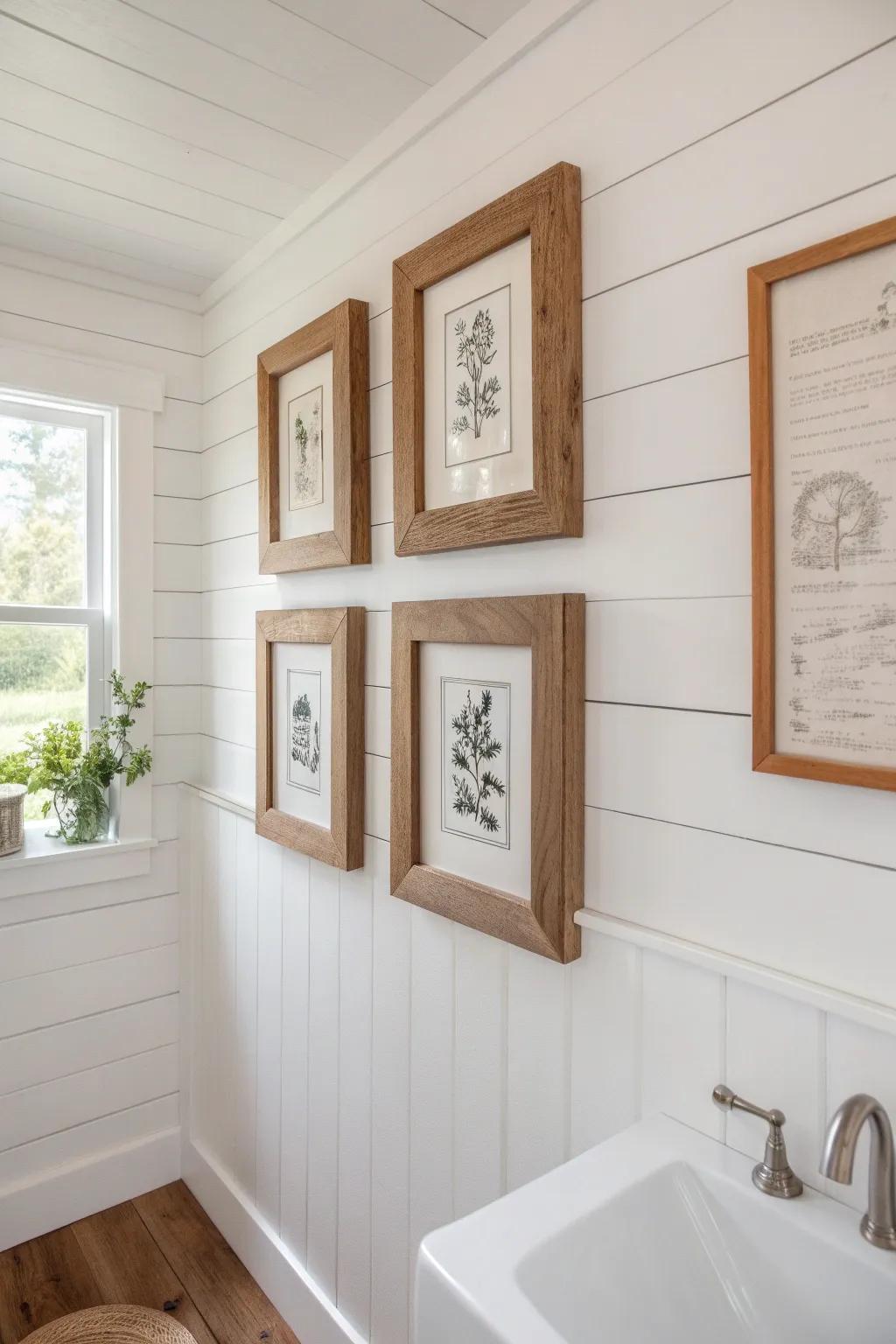 Mini gallery wall with chunky mismatched wood frames—simple prints for farmhouse bathroom charm.