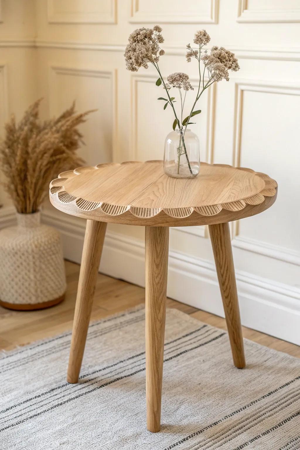 A scalloped-edge oak side table—soft, playful detail for a calm Scandinavian nursery.