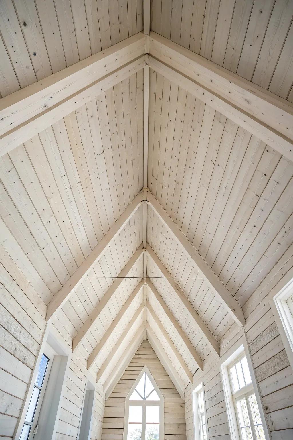 Whitewashed wood planks brighten a vaulted loft ceiling while keeping the grain beautifully visible.