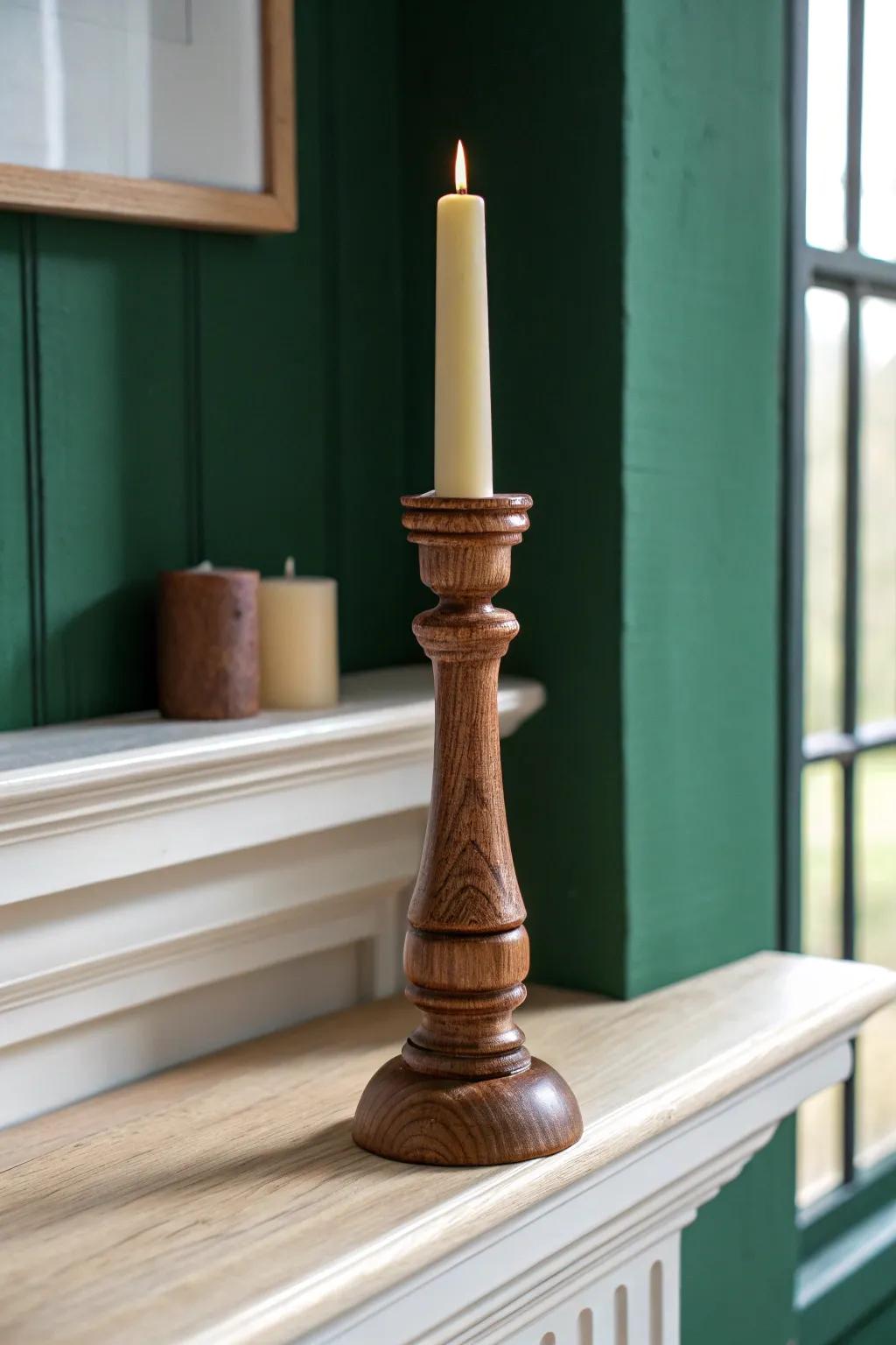 Hand-turned wooden candlestick adds cozy post‑Christmas warmth to a minimalist winter mantel.