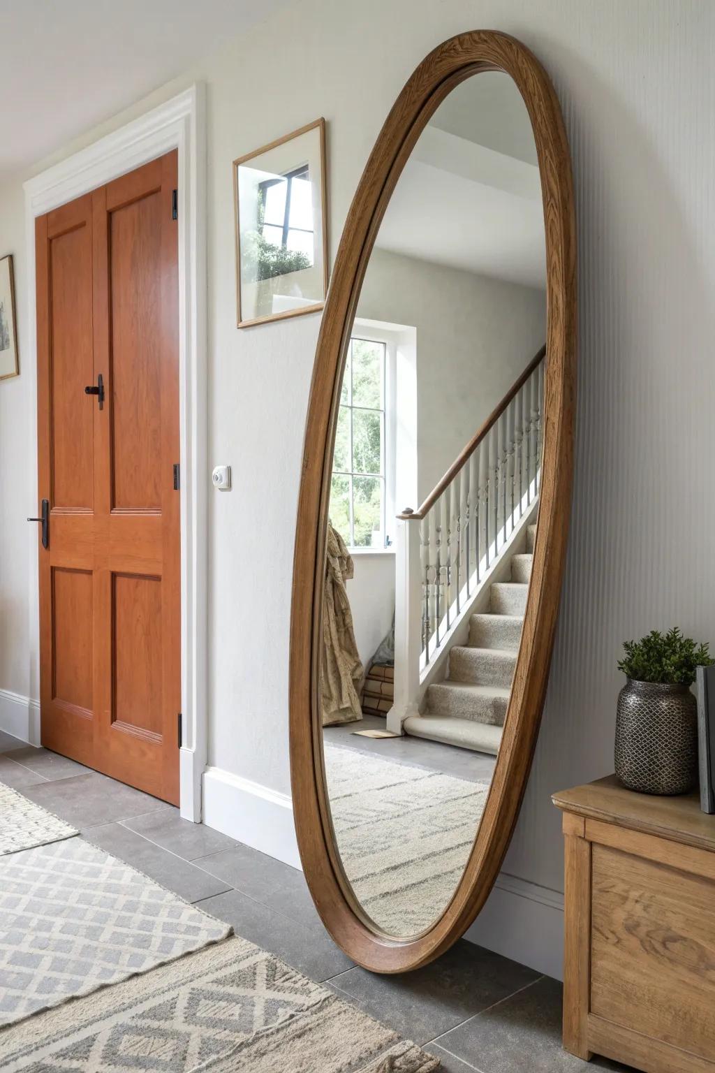 An oversized oak-framed mirror brightens the upstairs hall and adds warm, crafted texture.