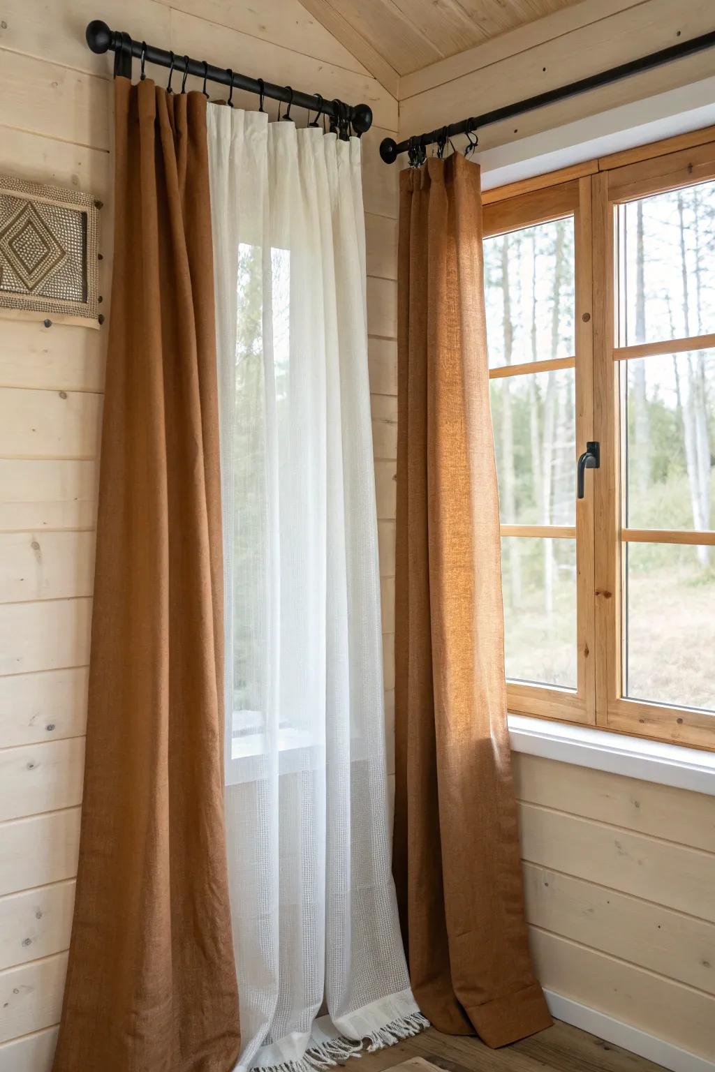 Layer sheers with cozy cabin drapes for glowy mornings and movie-night warmth.