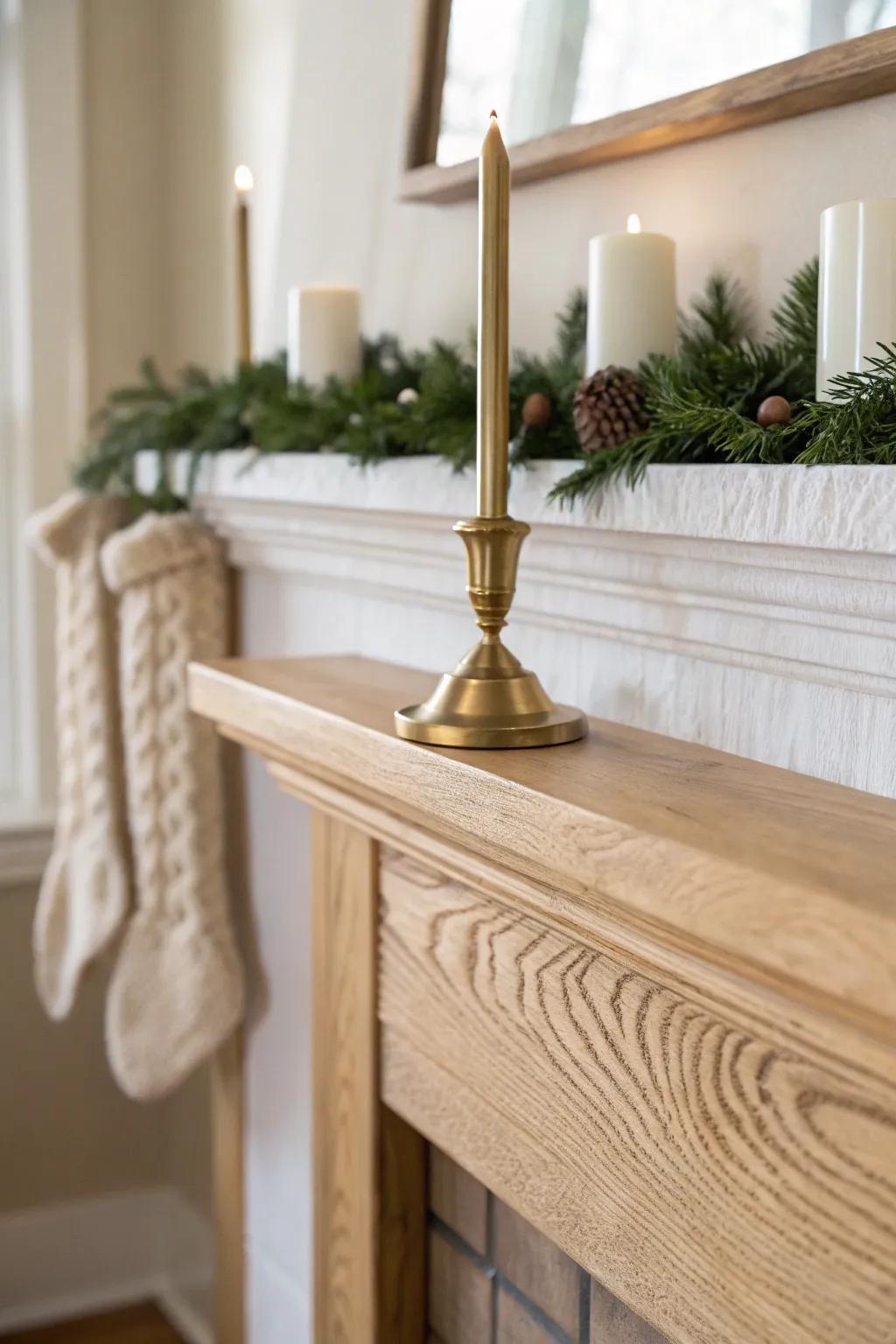 Modern farmhouse neutrals: a warm brass candleholder brings cozy glow to a simple wood mantel.