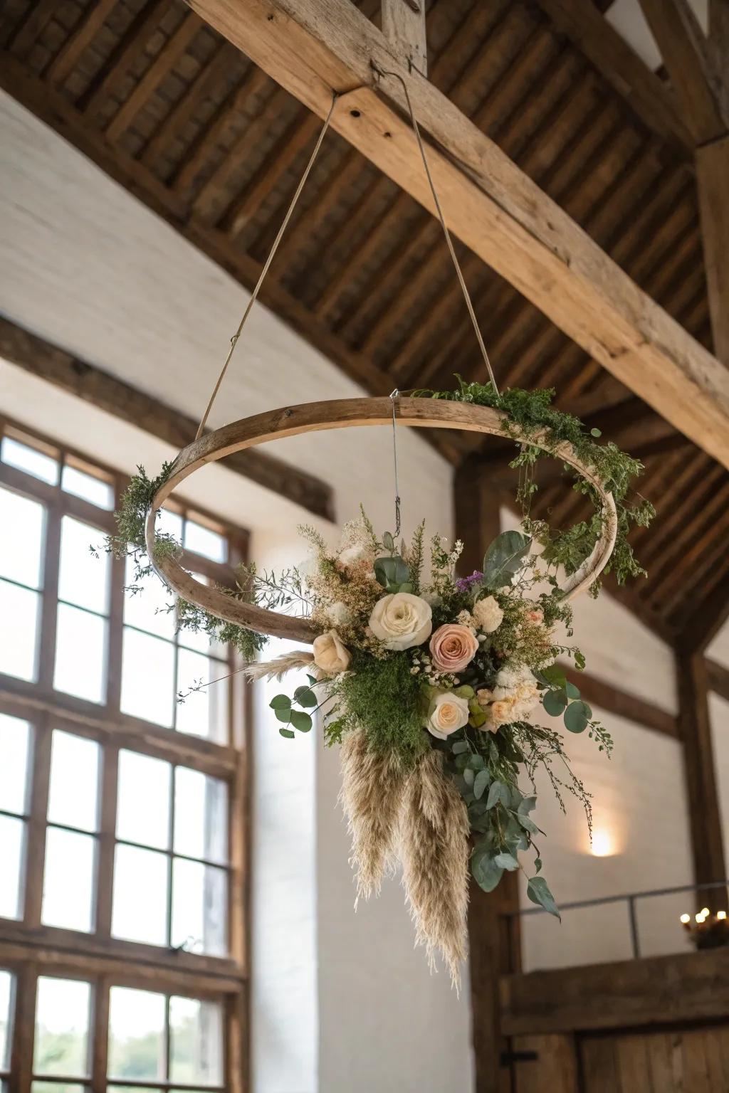 A modern floral hoop chandelier—airy greens, warm wood, and barn-beam drama.