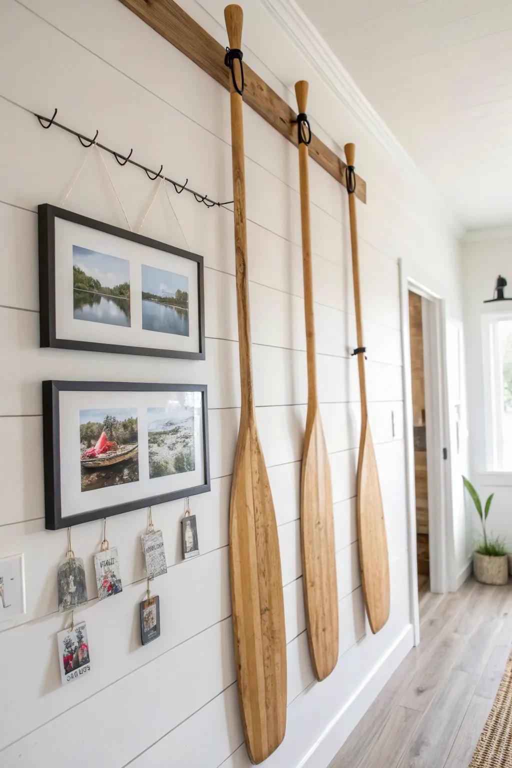 Frame-and-oar photo display: warm wood, small hooks, and a tidy, minimalist way to show memories.
