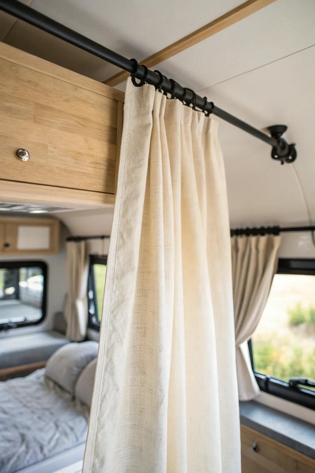 Ceiling-track linen privacy curtain turns your RV bed into a calm, cozy little retreat.